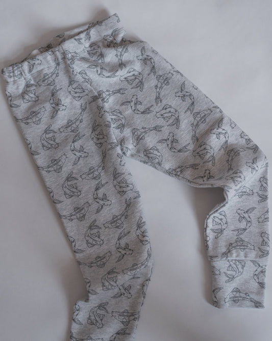 Leggings made from 100% GOTS certified organic cotton covered in our Koi fish allover print. Our leggings are designed with a soft elastic adjustable waist, foldable cuffs at the bottom of the legs.