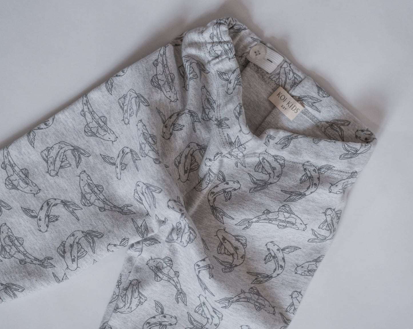 Leggings made from 100% GOTS certified organic cotton covered in our Koi fish allover print. Our leggings are designed with a soft elastic adjustable waist, foldable cuffs at the bottom of the legs.