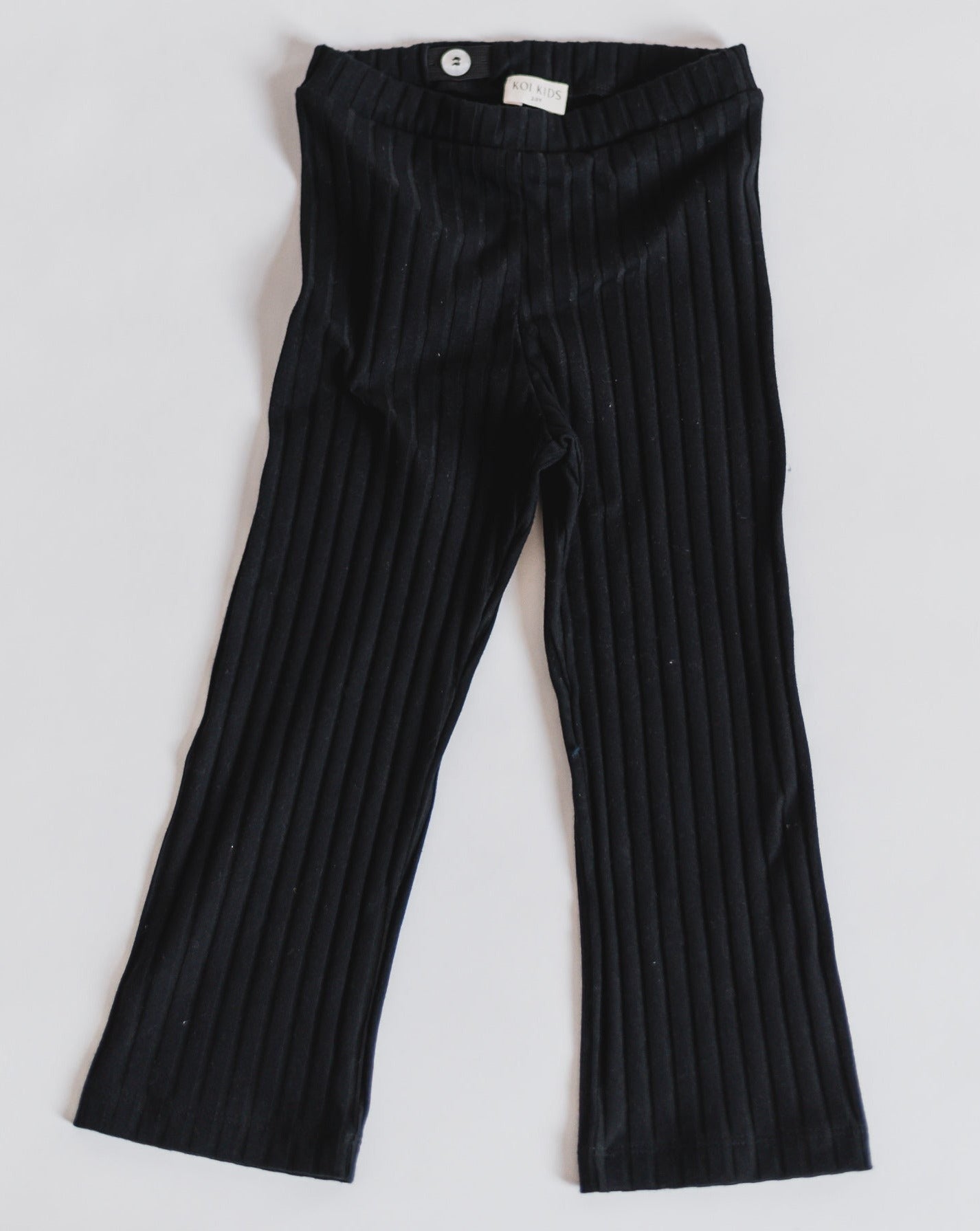 Black ribbed leggings with a wide leg and adjustable waist.