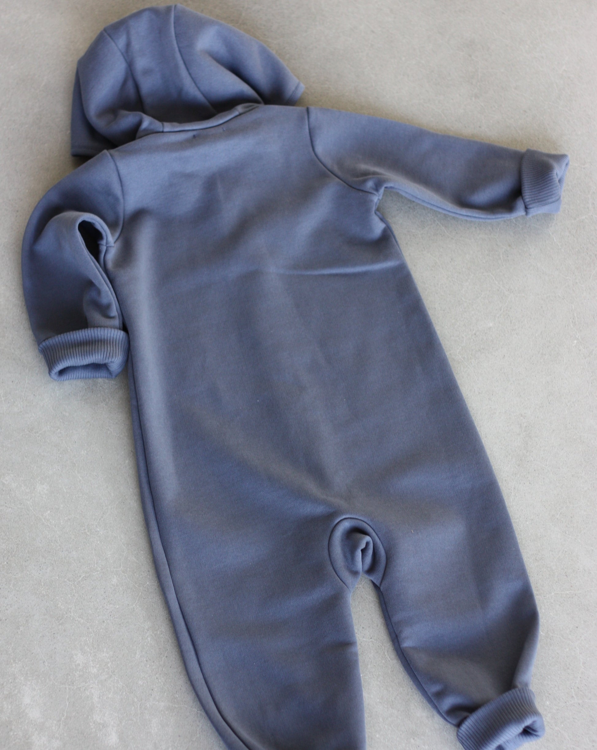Denim blue overall with zipper and hoodie. Made of the softest brushed organic cotton jersey.