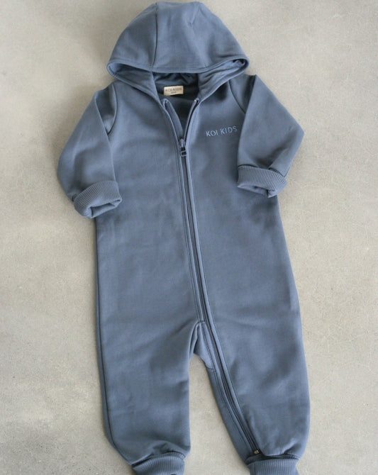 Denim blue overall with zipper and hoodie. Made of the softest brushed organic cotton jersey.